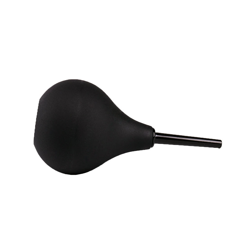 Black enema cleaner laying down from another angle, by Come Now