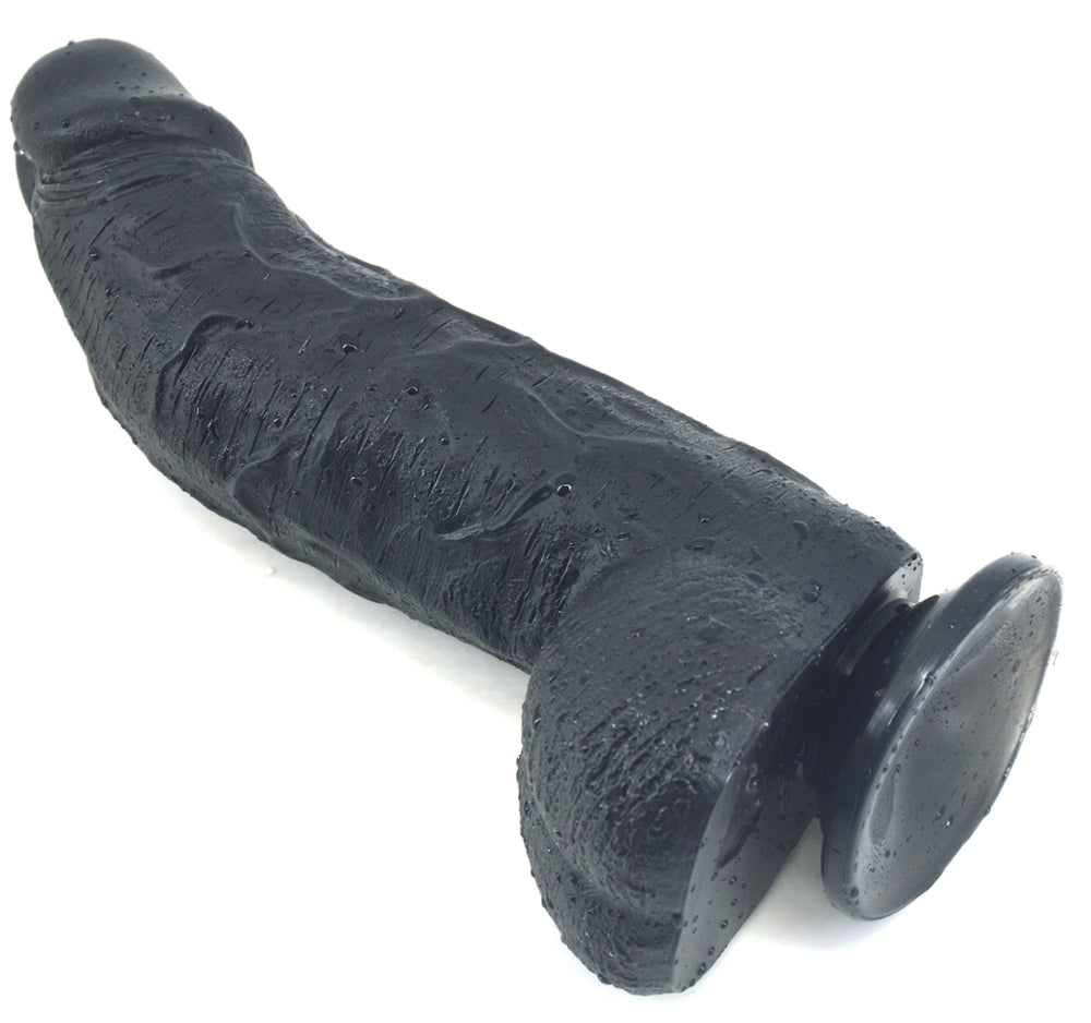 Black FAAK curved dildo right side laying view