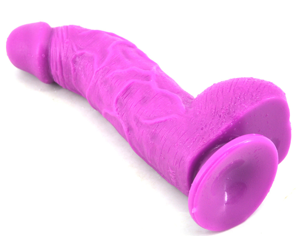 Purple FAAK curved dildo right side laying down