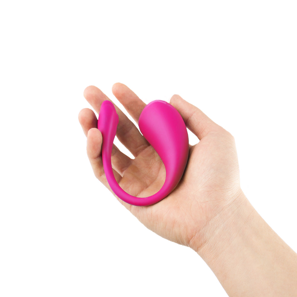 Pink Love Egg Vibrator held in a hand, demonstrating its compact and discreet design by Come Now