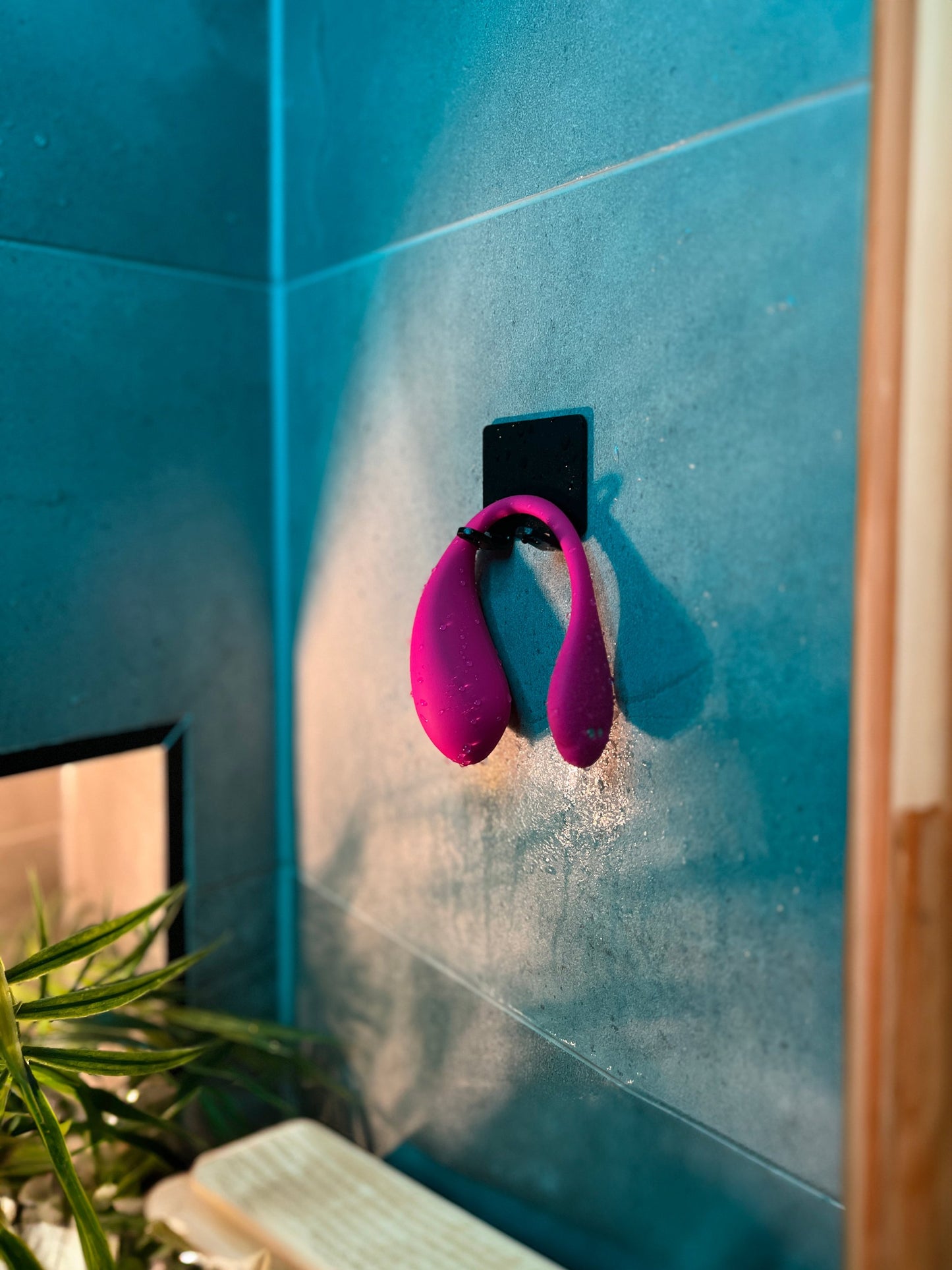 Love Egg Vibrator hanging in a shower, pink, showcasing its water-resistant and waterproof features by Come Now