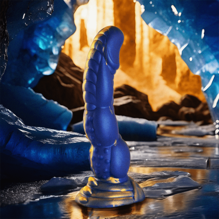 Poseidon Dildo in a cave setting with blue ice and golden rocks, showcasing its beauty