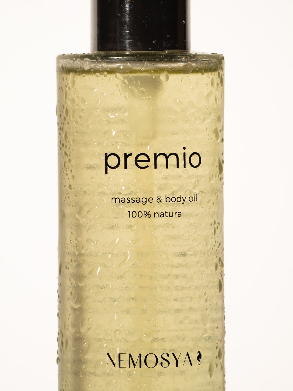 Nemosya premio, massage & body oil, 100% natural, coconut flavor, bottle, zoomed angle