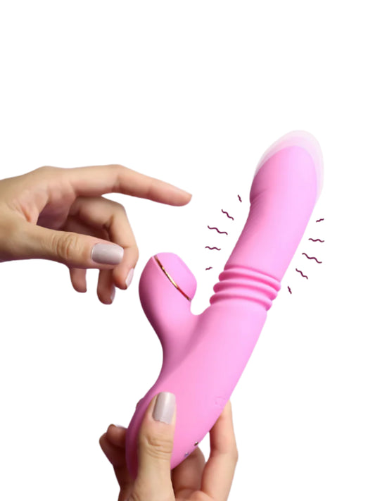 Pink twirling and suction vibrator held in a hand, demonstrating its vibration and suction capabilities